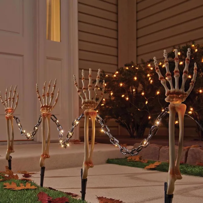 Celebrations Halloween Warm White 18 in. LED Prelit Chained Skeleton Arms Pathway Decor